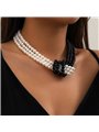 Collana Night & Day a triplo filo di perle con nodo centrale