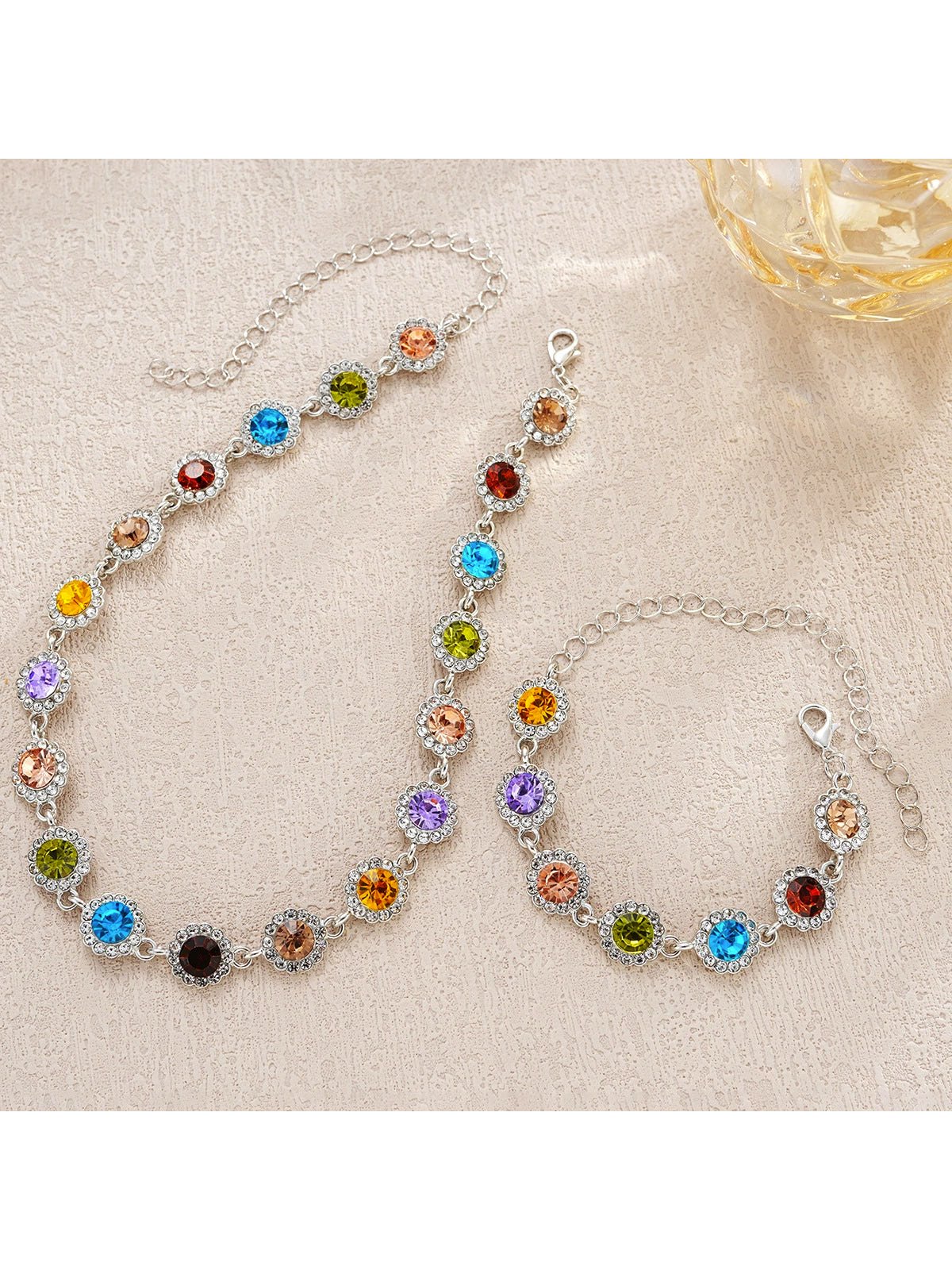 Parure Rainbow Halo con collana e bracciale ai cristalli colorati